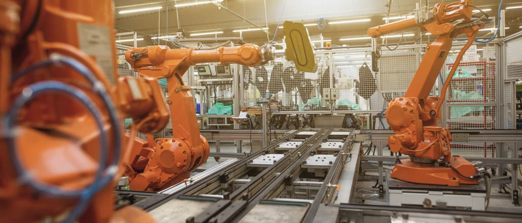 Robotic arms over a production line