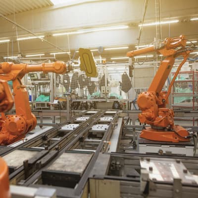 Robotic arms over a production line