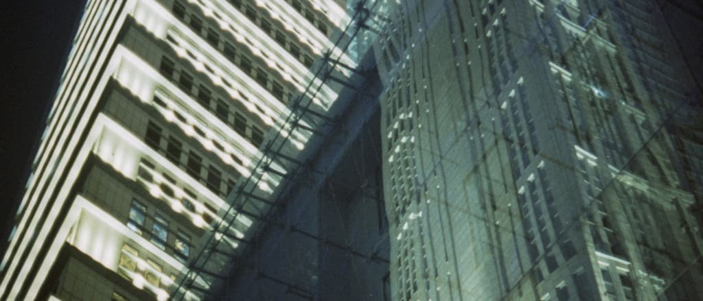 Office towers and glass reflections at night